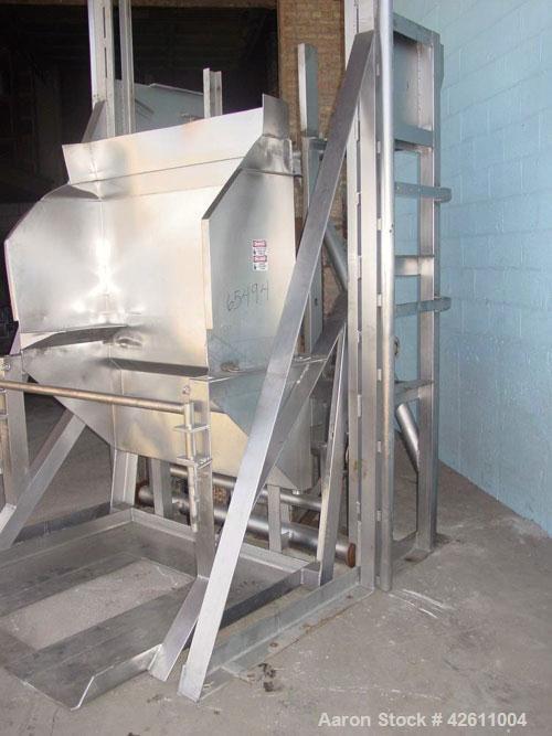 Used RMF Steel Products Hydraulic Box Dumper, model 110, stainless steel. 3,000 Pound capacity. Platform 52" wide X 52" long, maximum tote height 43", dump height approximately 96". Includes a dump c...