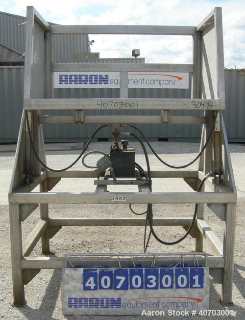 Used Box Dumper, 304 Stainless Steel. Dump area 54 1/2" wide x 39" deep x 28" high. Dual ram, hydraulically driven by a 2 hp, 3/60/208-230/460 volt, 1160 rpm motor. Approximate 60" dump height. Mount...