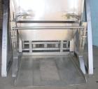 Used RMF Steel Products Hydraulic Box Dumper, model 110, stainless steel. 3,000 Pound capacity. Platform 52