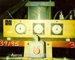 USED: Hot melt stamping press, downacting, 4 post type. 2" diameter threaded rod. Electrically heated platen 23" front-back x 35" left-right. Measurement between posts 29" x 41". 29" daylight. 4" dia...