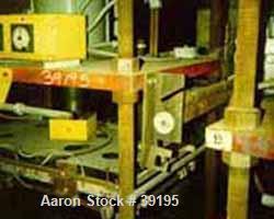 USED: Hot melt stamping press, downacting, 4 post type. 2" diameter threaded rod. Electrically heated platen 23" front-back x 35" left-right. Measurement between posts 29" x 41". 29" daylight. 4" dia...