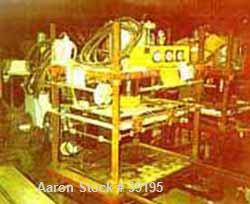 USED: Hot melt stamping press, downacting, 4 post type. 2" diameter threaded rod. Electrically heated platen 23" front-back x 35" left-right. Measurement between posts 29" x 41". 29" daylight. 4" dia...