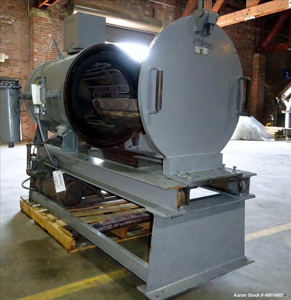 Used Beringer Jet Cleaner, Model 1724. Approximately 17" diameter x 24" long carbon steel chamber. Roll out parts tray approximate 23-1/2'' long. Maximum operating temperature 950 degrees F. Includes...