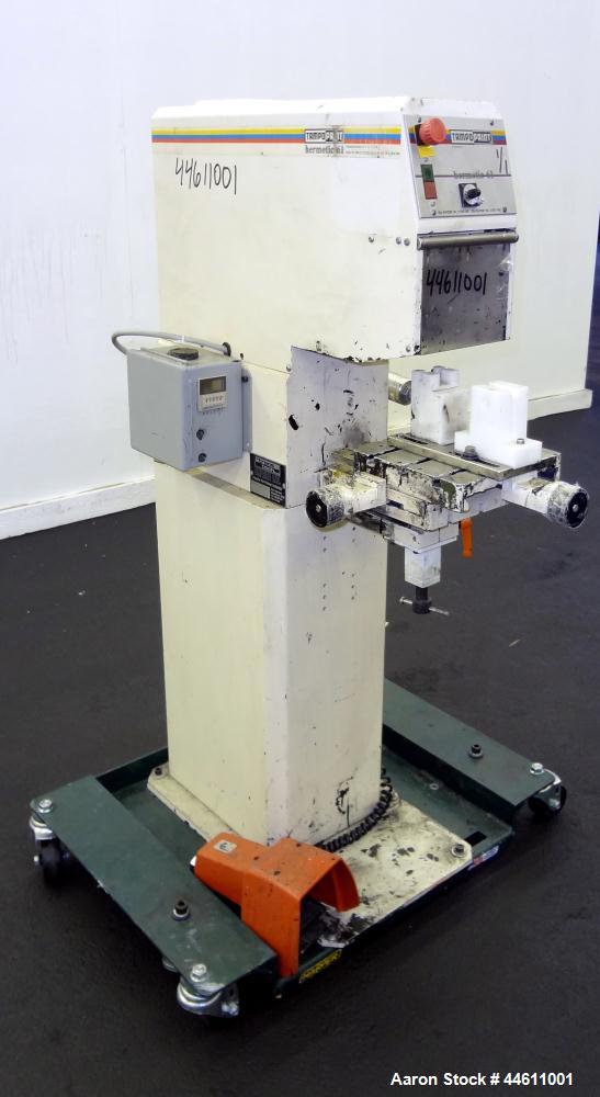 Used Tampo Print Pad Printer, Model Hermetic 61. Single cycle, approximately 1300-1400 per hour. Ink doctoring cup 60 mm, cliché size 70 mm x 140 mm, maximum print image size 55 mm. Includes foot ped...