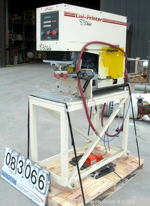 USED: United Silicone UNI Printer Pad Printer, model UP505. (4) Head, foot pedal control. 1/60/120 volt, 6 amp, 720 watt. Max print diameter 4-1/2", max cycle rate 1200/hour, ink reservoir diameter 5...