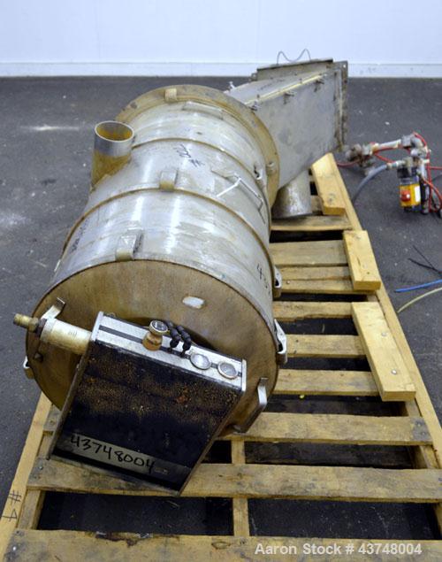 Used PIAB Vacuum Conveyor, Model VCP800, 316 Stainless Steel. Housing approximately 22" diameter x 38" long, rated 150 pounds per minute. Includes miscellaneous parts and valves.