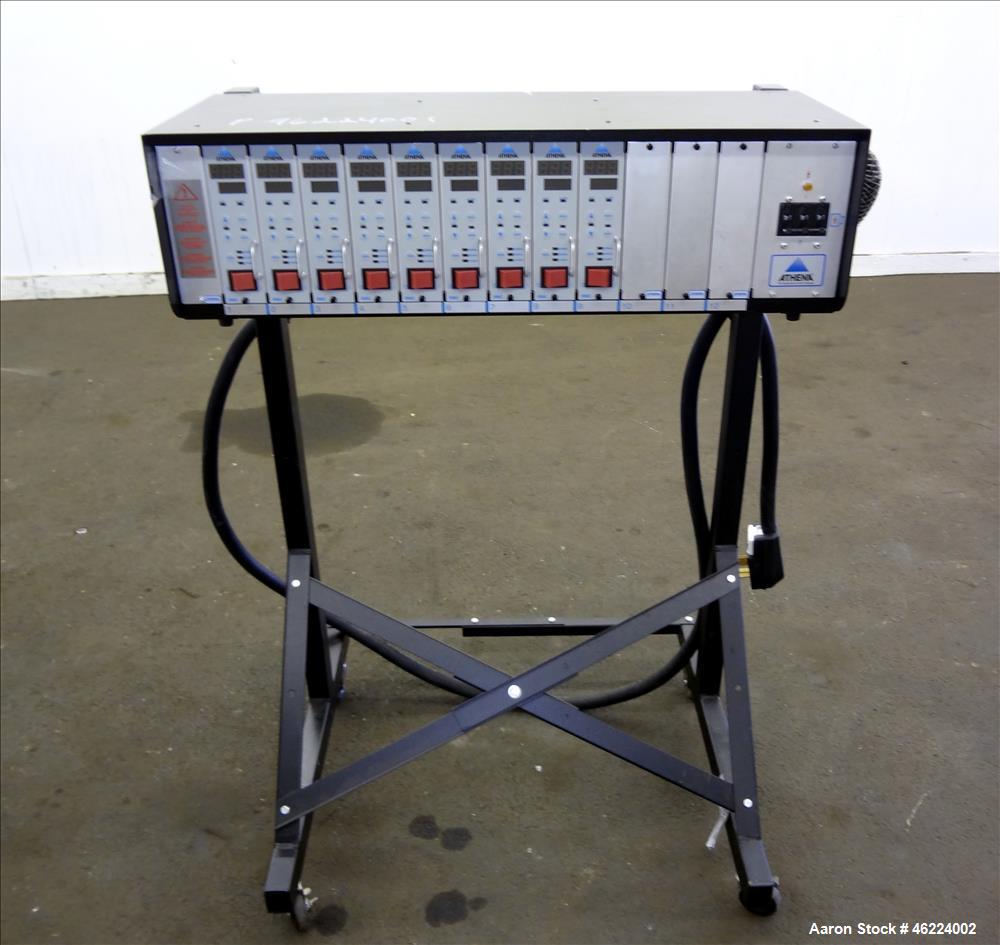 Used Athena Temperature Controller, Model MFL-C-D -12-00-000. 3/50/60 Hertz, supply 208-240 vac, load 50 amp / 21 kva. Includes (9) RMC controllers, and a stand with casters. Serial #0631000716.