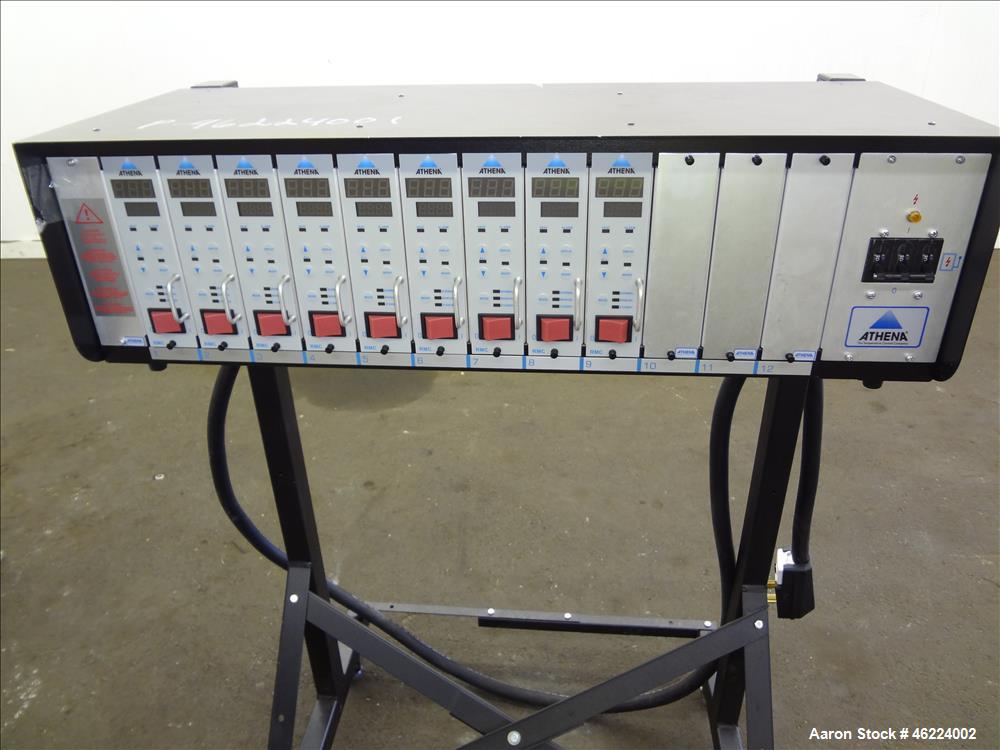 Used Athena Temperature Controller, Model MFL-C-D -12-00-000. 3/50/60 Hertz, supply 208-240 vac, load 50 amp / 21 kva. Includes (9) RMC controllers, and a stand with casters. Serial #0631000716.