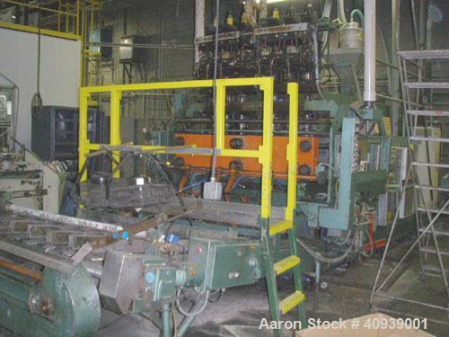 Used Uniloy Model 350R3 6 Head Blow Molder, new 1988. 6 heads are set on 8" centers, has Maaco 8000 programmable control and includes 6 tie bar platen with (2) sections each with 28.5" wide X 16" top...