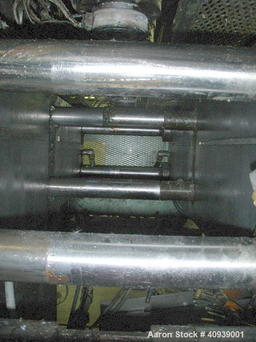 Used Uniloy Model 350R3 6 Head Blow Molder, new 1988. 6 heads are set on 8" centers, has Maaco 8000 programmable control and includes 6 tie bar platen with (2) sections each with 28.5" wide X 16" top...