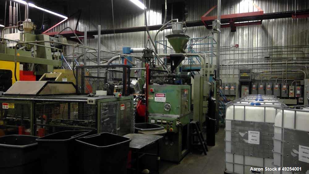 Used- Millcreek Blow Molding Machine. Rotary. 4 Station. Setup to run 1 gallon HDPE bottles with level strip. Does not inclu...
