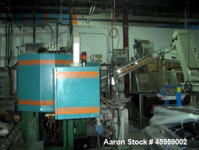 Used Amsler PET Bottle Blow Molding Machine, Model WAE 3. Was Last Running 1 L x 3 Up. 460 Volt/50 Amps plus 380 Volt/50 Amps.