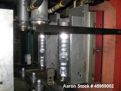 Used Amsler PET Bottle Blow Molding Machine, Model WAE 3. Was Last Running 1 L x 3 Up. 460 Volt/50 Amps plus 380 Volt/50 Amps.