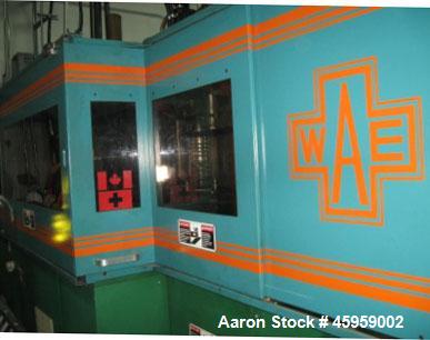 Used Amsler PET Bottle Blow Molding Machine, Model WAE 3. Was Last Running 1 L x 3 Up. 460 Volt/50 Amps plus 380 Volt/50 Amps.