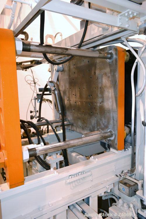 Used Hayssen Econoblow Blow Molding Machine, Model 75-S-2500. 5 lb FIFO accumulator head with programmable controls and MOOG parison programming. Also equipped with a part take away device and a bott...