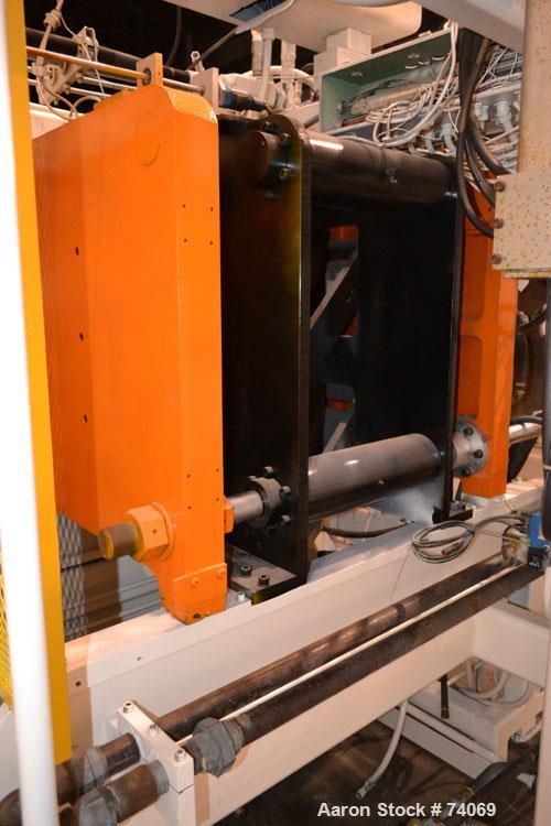 Used Hayssen Econoblow Blow Molding Machine, Model 75-S-2500. 5 lb FIFO accumulator head with programmable controls and MOOG parison programming. Also equipped with a part take away device and a bott...