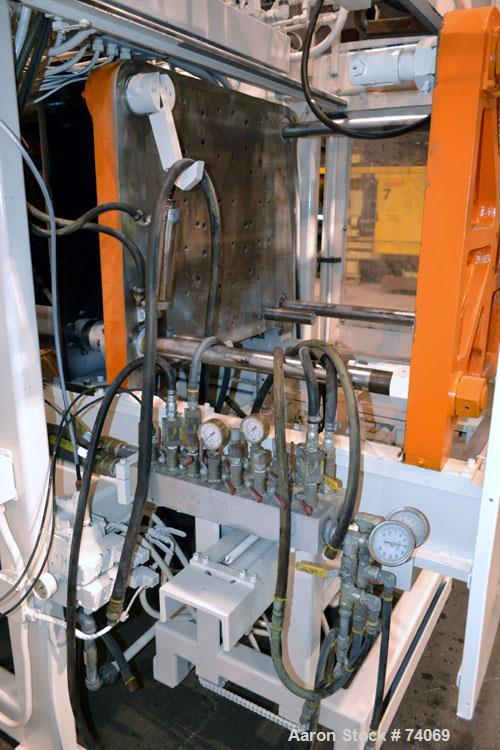 Used Hayssen Econoblow Blow Molding Machine, Model 75-S-2500. 5 lb FIFO accumulator head with programmable controls and MOOG parison programming. Also equipped with a part take away device and a bott...