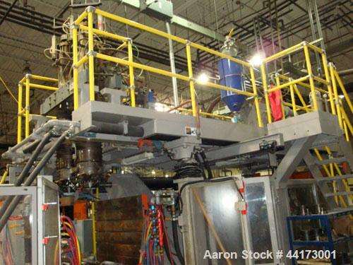 Used SIG Kautex Model KT75 Accumulator Blow Molder.  Dual head.  Shot size capacity 5.8 lbs.  Screw size 3.94" with L/D ratio 25:1.  Horsepower 125 @ 1750 rpm.  Approximately 660 lbs p/hour.  Through...