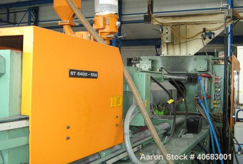 Used Stork ST4000-550 blow molder. Year of construction 1986. Clamp pressure 550 t, CDS 385 control panel, Geiger LR 21 CNC robot, cooling system, pre-mixer Koch Technik, energy saving device, dimens...