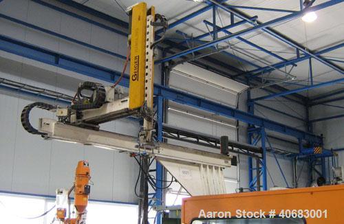 Used Stork ST4000-550 blow molder. Year of construction 1986. Clamp pressure 550 t, CDS 385 control panel, Geiger LR 21 CNC robot, cooling system, pre-mixer Koch Technik, energy saving device, dimens...