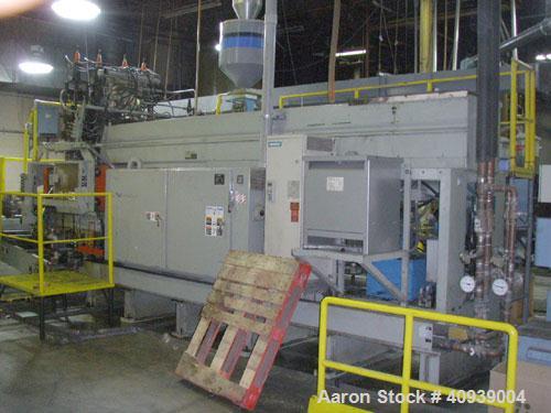 Used Uniloy Model 400R20, Serial #4983 Reciprocating Blow Molder. No side shift. Has 4 head design on 14" centers. Overall clamp is 21.5" top to bottom X 68" wide. 6 tie bar clamp with (2) compartmen...