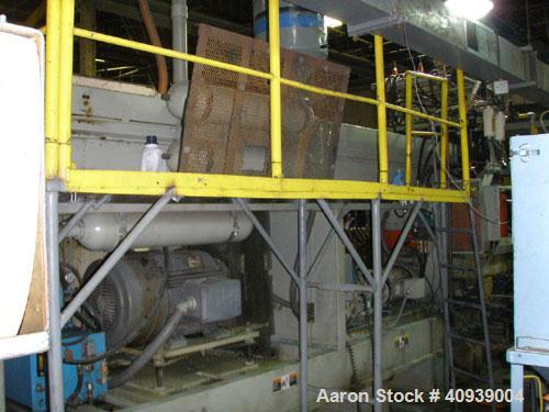 Used Uniloy Model 400R20, Serial #4983 Reciprocating Blow Molder. No side shift. Has 4 head design on 14" centers. Overall clamp is 21.5" top to bottom X 68" wide. 6 tie bar clamp with (2) compartmen...