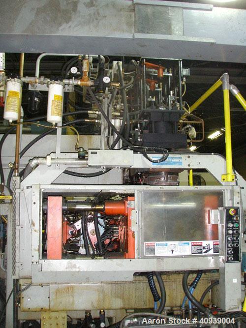 Used Uniloy Model 400R20, Serial #4983 Reciprocating Blow Molder. No side shift. Has 4 head design on 14" centers. Overall clamp is 21.5" top to bottom X 68" wide. 6 tie bar clamp with (2) compartmen...