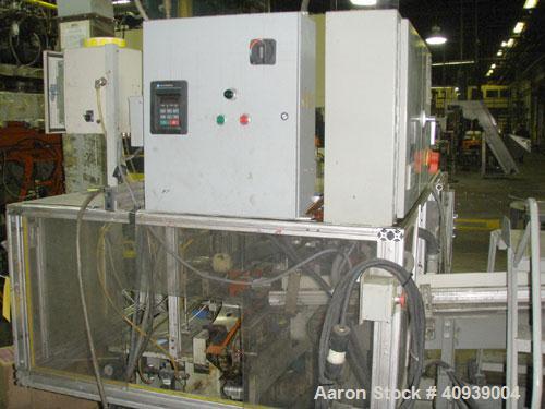 Used Uniloy Model 400R20, Serial #4983 Reciprocating Blow Molder. No side shift. Has 4 head design on 14" centers. Overall clamp is 21.5" top to bottom X 68" wide. 6 tie bar clamp with (2) compartmen...