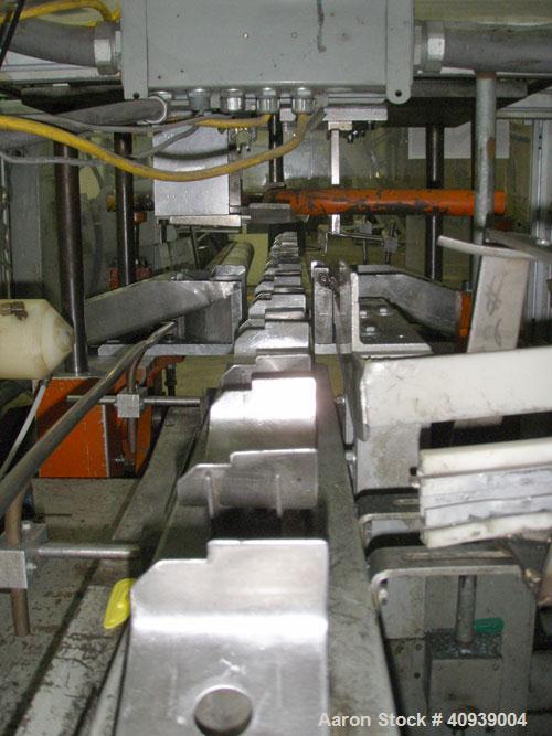 Used Uniloy Model 400R20, Serial #4983 Reciprocating Blow Molder. No side shift. Has 4 head design on 14" centers. Overall clamp is 21.5" top to bottom X 68" wide. 6 tie bar clamp with (2) compartmen...