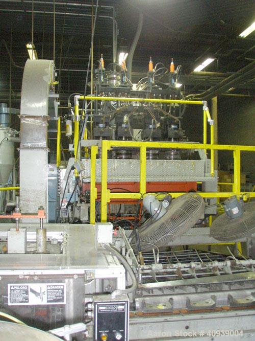Used Uniloy Model 400R20, Serial #4983 Reciprocating Blow Molder. No side shift. Has 4 head design on 14" centers. Overall clamp is 21.5" top to bottom X 68" wide. 6 tie bar clamp with (2) compartmen...