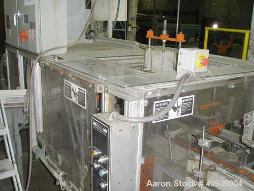 Used Uniloy Model 400R20, Serial #4983 Reciprocating Blow Molder. No side shift. Has 4 head design on 14" centers. Overall clamp is 21.5" top to bottom X 68" wide. 6 tie bar clamp with (2) compartmen...