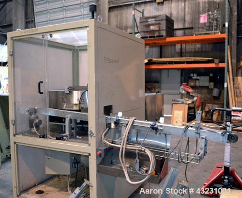 Used Uniloy Milacron Alkam Stretch Blow Molding Machine, Model BM-4. (4) Blow cavities/mould, 130mm distance between cavities. Unit includes an infeed system with a hopper, elevator, orienter, and in...