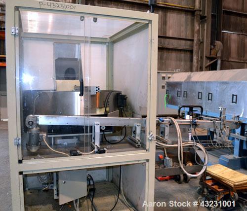Used Uniloy Milacron Alkam Stretch Blow Molding Machine, Model BM-4. (4) Blow cavities/mould, 130mm distance between cavities. Unit includes an infeed system with a hopper, elevator, orienter, and in...
