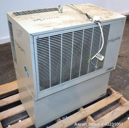 Used Uniloy Milacron Alkam Stretch Blow Molding Machine, Model BM-4. (4) Blow cavities/mould, 130mm distance between cavities. Unit includes an infeed system with a hopper, elevator, orienter, and in...