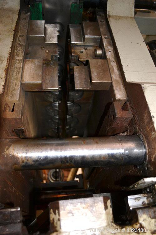 Used Uniloy Milacron Alkam Stretch Blow Molding Machine, Model BM-5. (5) Blow cavities/mould, 105mm distance between cavities. Unit includes an infeed system with a hopper, elevator, orienter, and in...