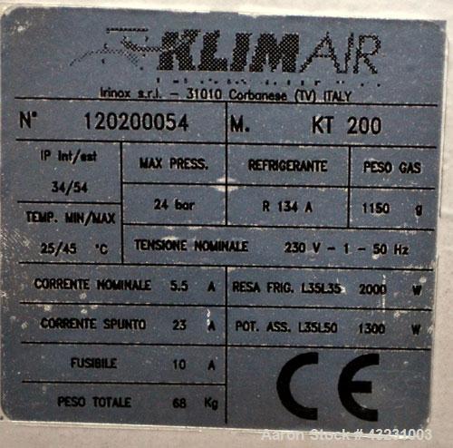 Used Uniloy Milacron Alkam Stretch Blow Molding Machine, Model BM-5. (5) Blow cavities/mould, 105mm distance between cavities. Unit includes an infeed system with a hopper, elevator, orienter, and in...