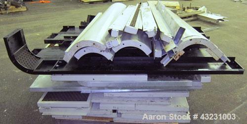Used Uniloy Milacron Alkam Stretch Blow Molding Machine, Model BM-5. (5) Blow cavities/mould, 105mm distance between cavities. Unit includes an infeed system with a hopper, elevator, orienter, and in...