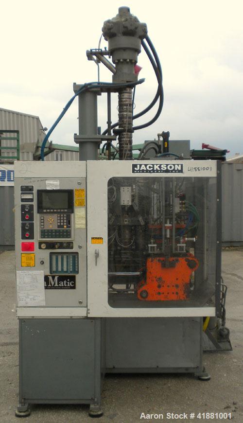 Used Jackson Machinery Triple Head VersaMatic Blow Molding Machine, Model 2165. Platen size 14-1/2" x 14-1/2", mold height 8.5’’ to 11’’. Maximum daylight 19.75", Clamp stroke 8.5". Head center 115MM...