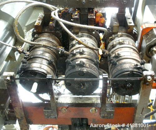Used Jackson Machinery Triple Head VersaMatic Blow Molding Machine, Model 2165. Platen size 14-1/2" x 14-1/2", mold height 8.5’’ to 11’’. Maximum daylight 19.75", Clamp stroke 8.5". Head center 115MM...