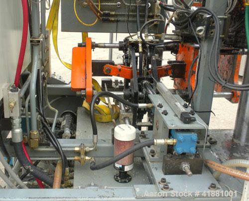 Used Jackson Machinery Triple Head VersaMatic Blow Molding Machine, Model 2165. Platen size 14-1/2" x 14-1/2", mold height 8.5’’ to 11’’. Maximum daylight 19.75", Clamp stroke 8.5". Head center 115MM...