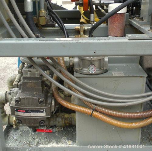Used Jackson Machinery Triple Head VersaMatic Blow Molding Machine, Model 2165. Platen size 14-1/2" x 14-1/2", mold height 8.5’’ to 11’’. Maximum daylight 19.75", Clamp stroke 8.5". Head center 115MM...
