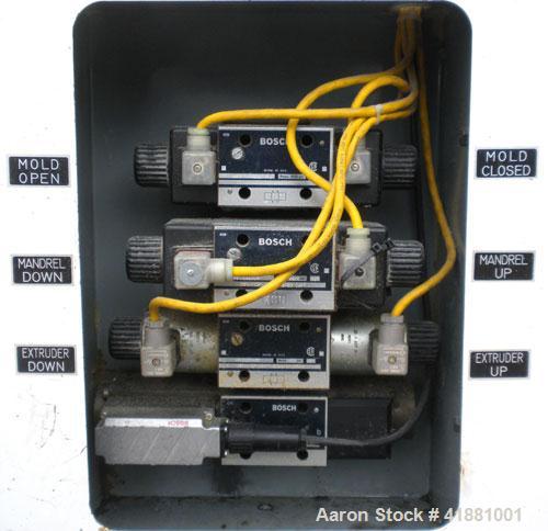Used Jackson Machinery Triple Head VersaMatic Blow Molding Machine, Model 2165. Platen size 14-1/2" x 14-1/2", mold height 8.5’’ to 11’’. Maximum daylight 19.75", Clamp stroke 8.5". Head center 115MM...