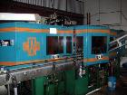 Used Amsler PET Bottle Blow Molding Machine, Model WAE 3. Was Last Running 1 L x 3 Up. 460 Volt/50 Amps plus 380 Volt/50 Amps.