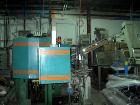 Used Amsler PET Bottle Blow Molding Machine, Model WAE 3. Was Last Running 1 L x 3 Up. 460 Volt/50 Amps plus 380 Volt/50 Amps.