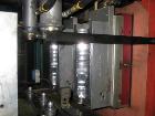 Used Amsler PET Bottle Blow Molding Machine, Model WAE 3. Was Last Running 1 L x 3 Up. 460 Volt/50 Amps plus 380 Volt/50 Amps.