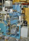 Used Rocheleau blow molder, model R4-99-155, single head.