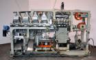 Used Uniloy Milacron Alkam Stretch Blow Molding Machine, Model BM-4. (4) Blow cavities/mould, 130mm distance between cavities. Unit includes an infeed system with a hopper, elevator, orienter, and in...