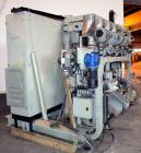 Used Uniloy Milacron Alkam Stretch Blow Molding Machine, Model BM-4. (4) Blow cavities/mould, 130mm distance between cavities. Unit includes an infeed system with a hopper, elevator, orienter, and in...