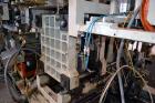 Used Uniloy Milacron Alkam Stretch Blow Molding Machine, Model BM-4. (4) Blow cavities/mould, 130mm distance between cavities. Unit includes an infeed system with a hopper, elevator, orienter, and in...