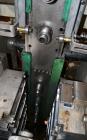 Used Uniloy Milacron Alkam Stretch Blow Molding Machine, Model BM-4. (4) Blow cavities/mould, 130mm distance between cavities. Unit includes an infeed system with a hopper, elevator, orienter, and in...